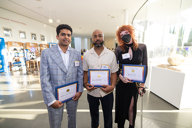 Arts & Humanities Graduate Exhibition winners Nitheen_Ramalingam, Damien Mitchell and April_Camlin stand together for a photo during the reception at the Jan Shrem and Maria Manetti Shrem Museum of Ar