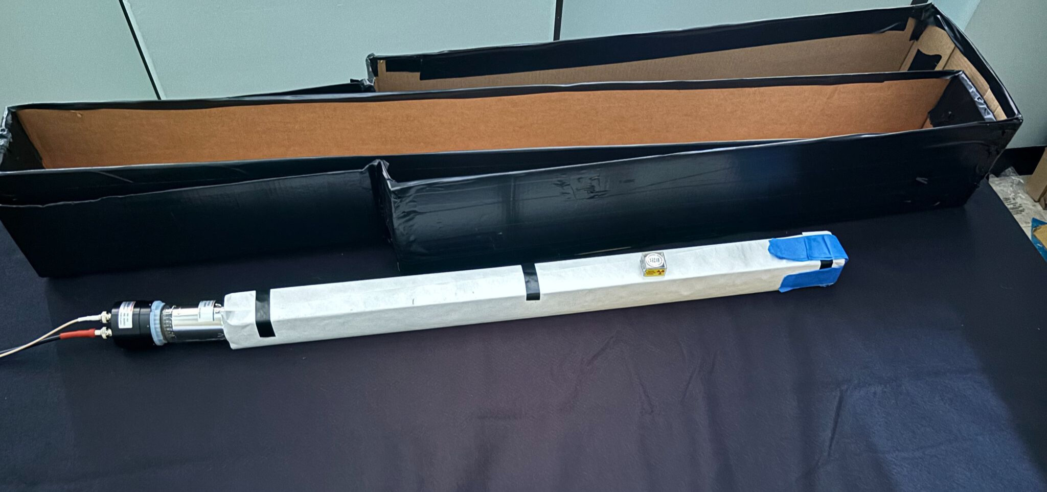One of the FORMOSA demonstrator's scintillator bars with a PMT attachment. (Courtesy of Ayush Gilotra)