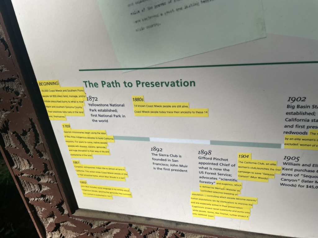 a hiking trail sign with a timeline of preservation with added edits.