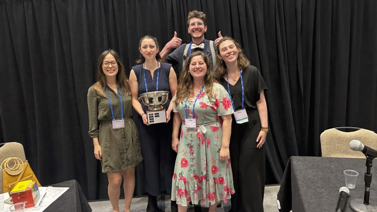 A group of UC Davis anthropology students pose with their trophy from the SAA Ethics Bowl