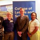 A group photo of Distinguished Professor Andreas Albrecht, Michael Vaida, Ph.D. '73, Knox, Dean Estella Atekwana and Professor Richard Scalettar.
